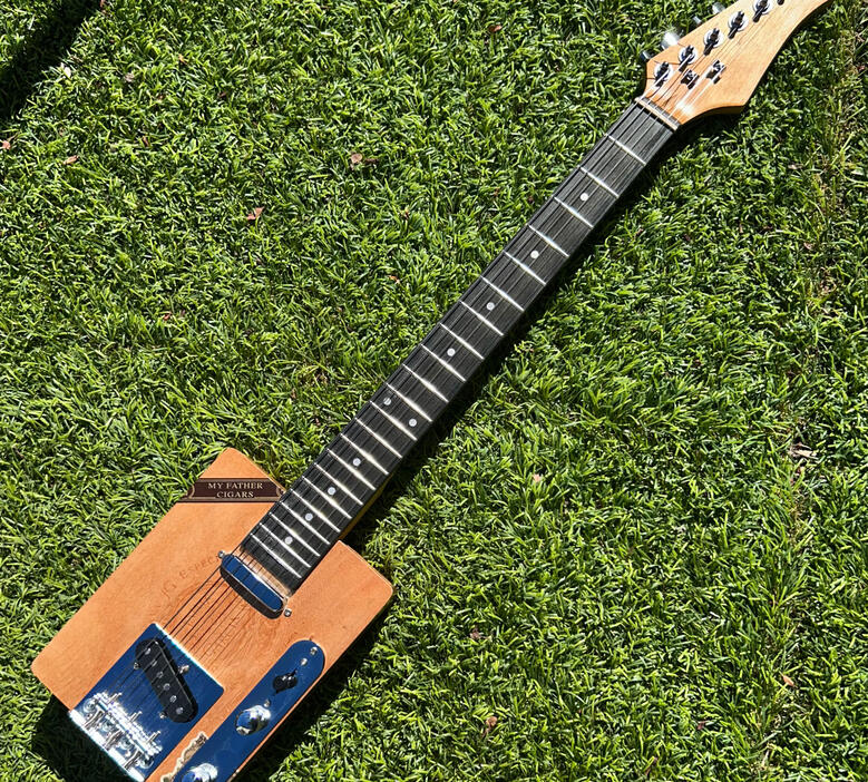 A photo of a Cigar Box Guitar created by Ray Riordan