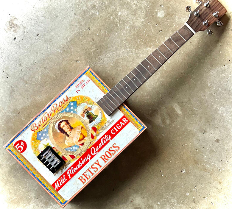 A photo of a Cigar Box Uke created by Ray Riordan