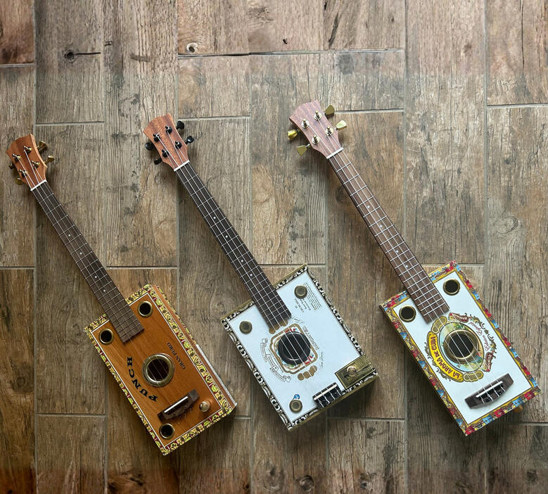 A photo of 3 Cigar Box Ukes created by Ray Riordan