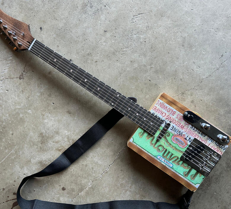 A photo of a Cigar Box Guitar created by Ray Riordan