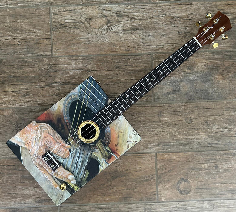 A photo of a Cigar Box Guitar Uke created by Ray Riordan