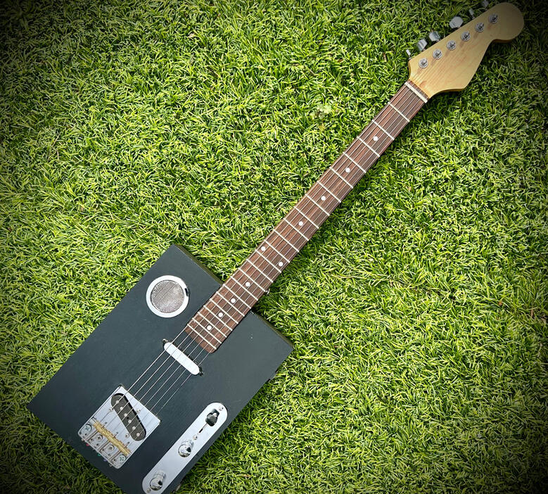 A photo of a Cigar Box Guitar created by Ray Riordan
