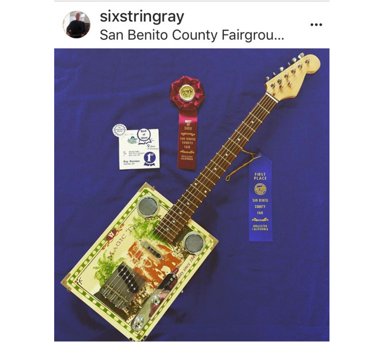 A photo of a Cigar Box Guitar created by Ray Riordan